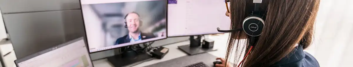 Two colleagues talk in a video call.