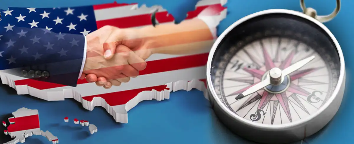 Compass next to an American Flag in the shape of the USA
