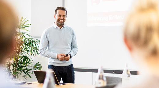 An expert presents his topic to avid listeners.