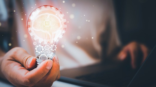 man holding AI light bulb